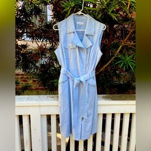 Soft blue fitted zip up Calvin Klein dress with tie at waist.
